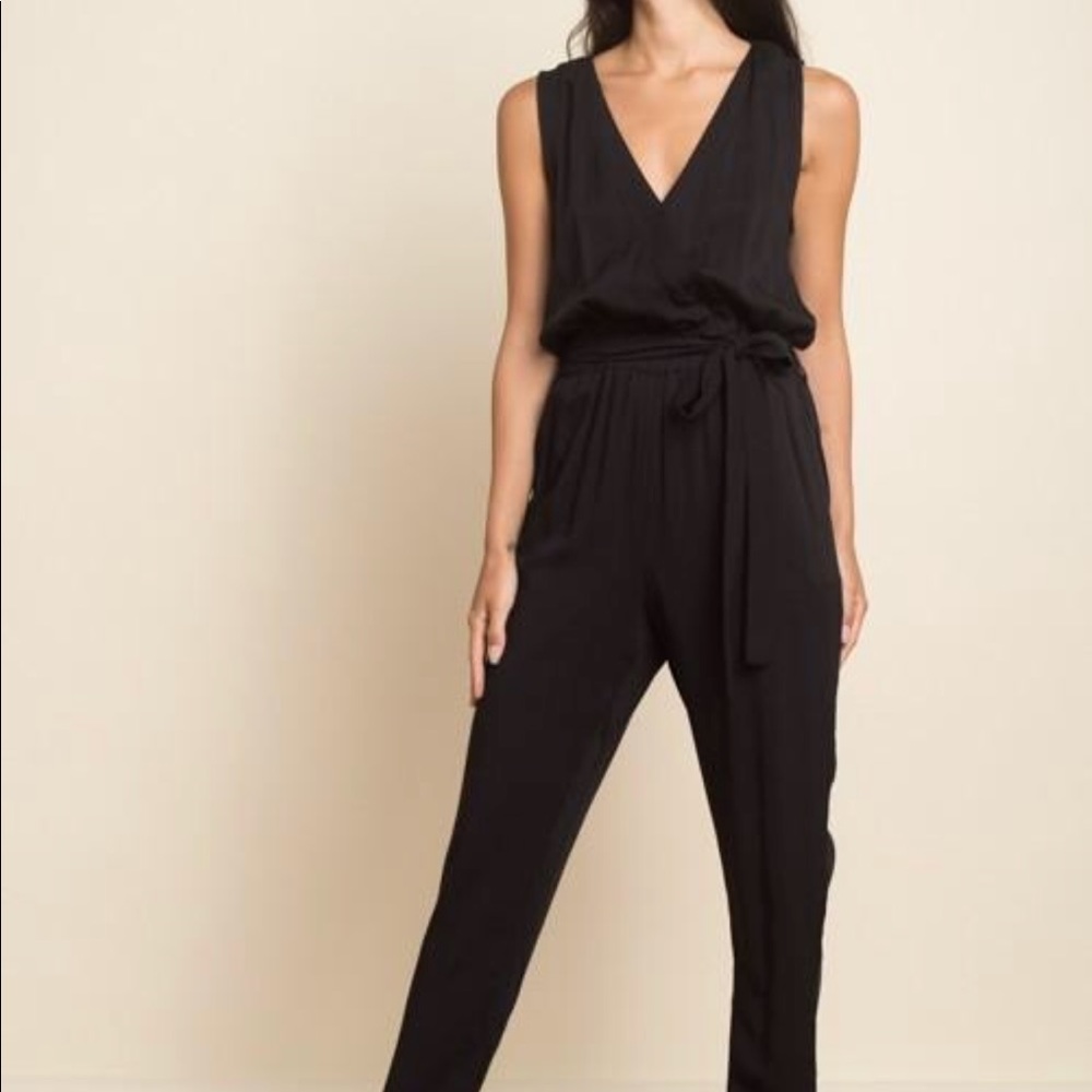 NWT Black Jump Suit. Adjustable Tie.